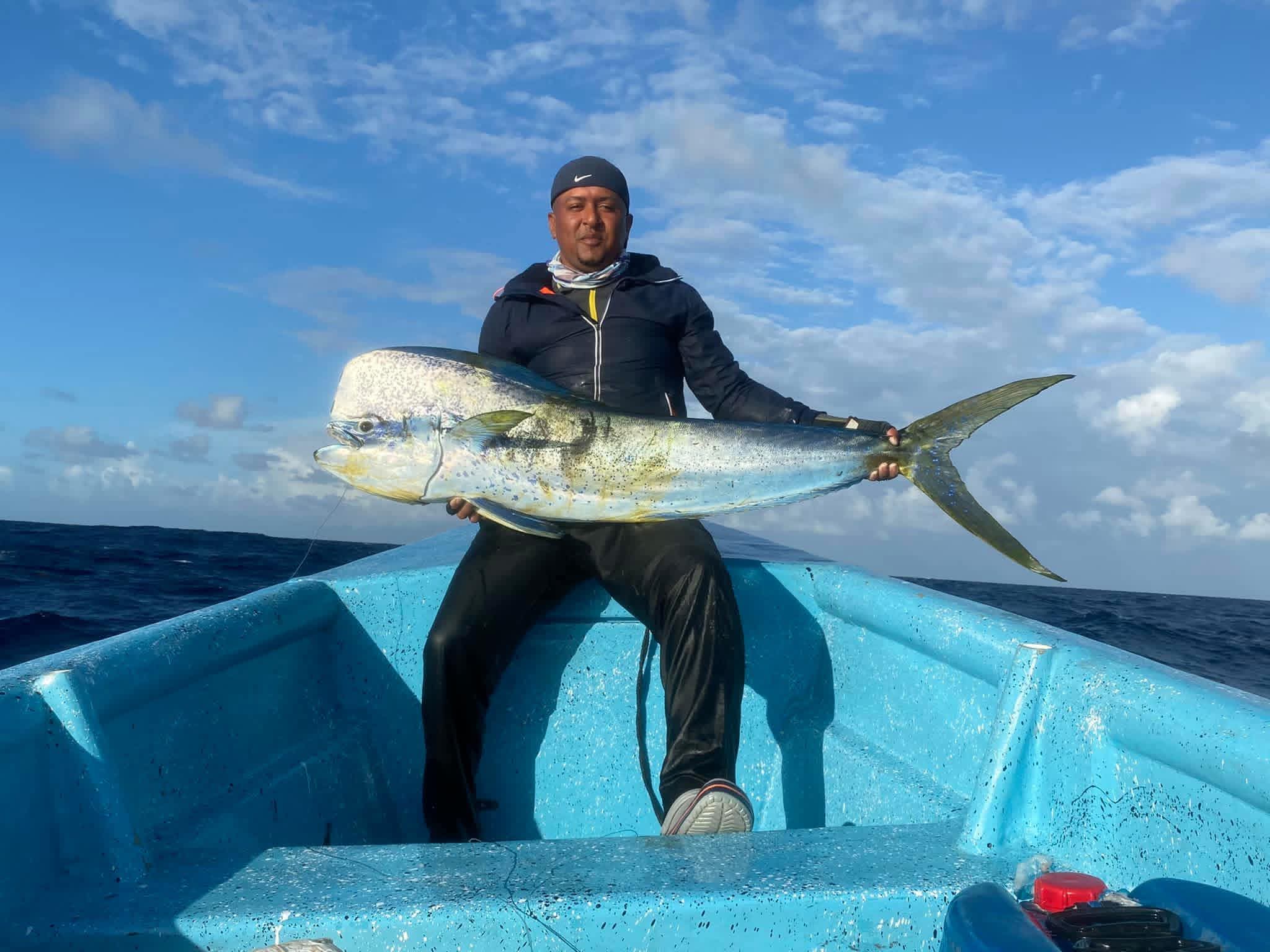 Fisherman with dorado catch