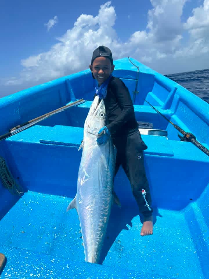 Young fisherman with wahoo
